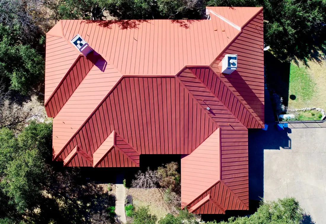 Metal roof installation on a residential home in San Antonio by Apache Construction Concepts
